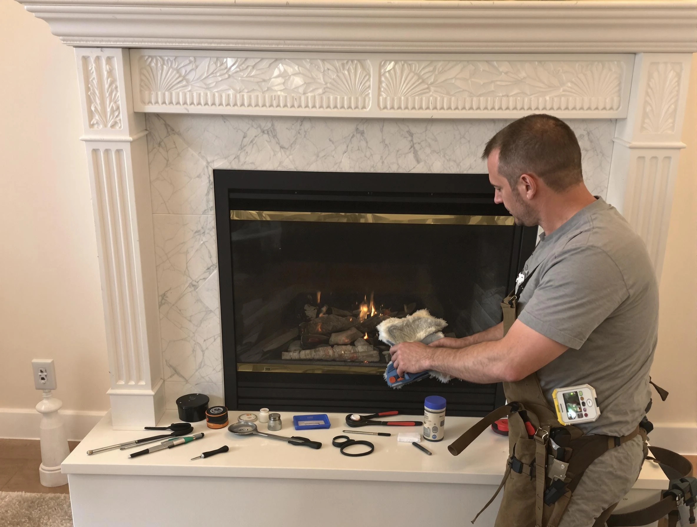 Needham Chimney Sweep performing fireplace maintenance in Needham, MA